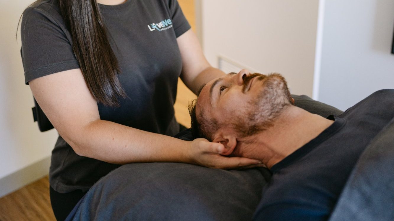 Dr Samantha Volarich performing gentle cervical osteopathic treatment for headache relief at Live Well Health Centre