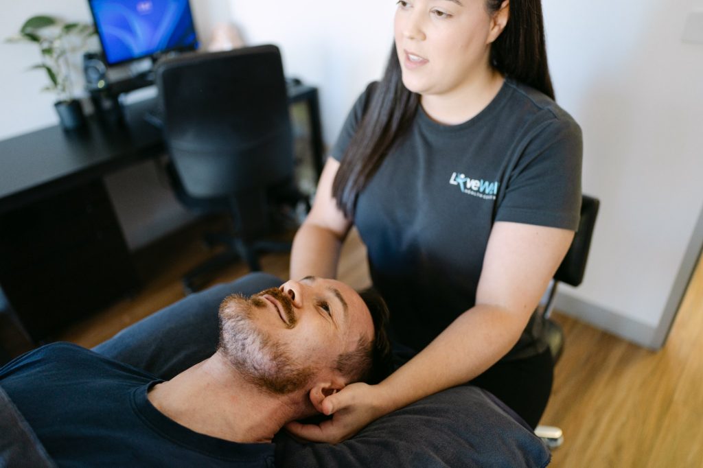 Live Well osteopath applying gentle cranial and cervical treatment to patient for migraine relief