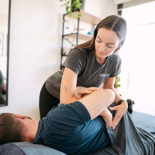 Live Well osteopath performing thoracic spinal mobilisation on patient for postural strain relief