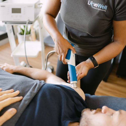 Shockwave Therapy for Knee Tendon Pain – Live Well Shockwave therapy applied to knee tendon during osteopathy treatment at Live Well Health Centre.